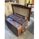 Two vintage suitcases together with a pair of modern cane back single bed ends. (4) (B.P. 21% + VAT)
