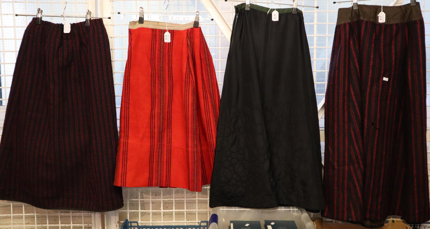 Four antique (probably late 19th Century) skirts to include: three traditional Welsh costume woollen