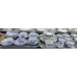 Two trays of blue and white china teaware to include: Orchid design teacups and saucers and small