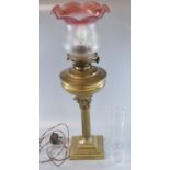 Early 20th century double oil burner lamp now converted to electricity, having clear and frosted