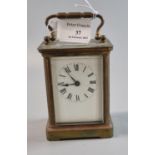 Early 20th century brass carriage clock with full depth Roman ceramic face. 1.5cm high approx. (B.P.