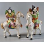 Two porcelain figurines of horses and riders, probably Chinese, appearing modern. (2) (B.P. 21% +