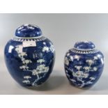 Two Chinese late Qing style blue and white ginger jars and covers, double circle marks to the