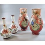 Pair of opaline glass flask shaped vases, overall with hand painted decoration of birds, bamboo
