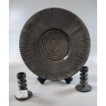 Robert Welch, a pair of cast iron candlesticks, together with a matching dish or shallow bowl. (