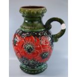 Large West German pottery single handled baluster jug, the body overall decorated with red