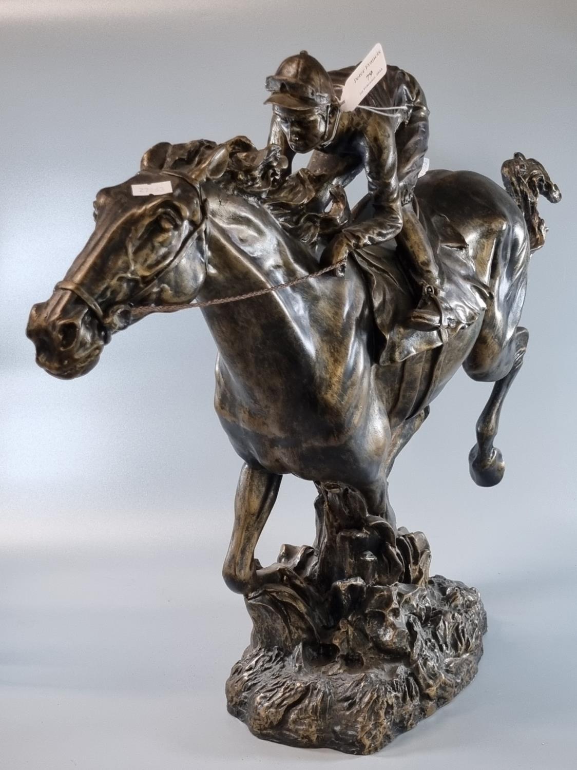 Modern bronzed hollow study of a horse and jockey on naturalistic base. 50cm high approx. (B.P.