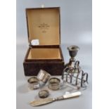 Box of assorted silver, to include: four section toast rack, three napkin rings, small silver oval