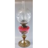 Early 20th century double oil burner lamp having frosted and clear glass globular etched foliate