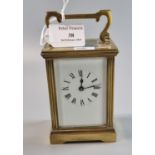20th century brass carriage clock with fluted columns, fluted corner angles and full depth ceramic