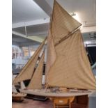 Large authentic model of a single mast yacht. 125cm high and 120cm long approx. (B.P. 21% + VAT)