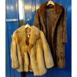 Two vintage fur coats: one is a Fox fur short coat, the other three quarter length dark brown coat