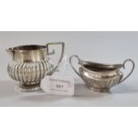 Small silver fluted design cream jug with geometric handle, Birmingham hallmarks, together with a