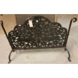 Metal pierced firescreen standing on stylised turned supports. (B.P. 21% + VAT)