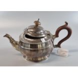 Silver baluster shaped teapot with turned wooden handle and finial. Chester hallmarks. 16.5 troy