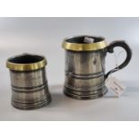 Pair of 19th century pewter measures with touch marks and brass rims. Half pint and pint. 9cm high