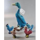 Mixed group of five porcelain animal figures, to include: a turquoise duck and four polychrome