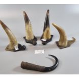 Set of four horn coat/hat hooks together with another animal horn. (B.P. 21% + VAT)