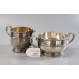 Matching silver cream jug and two handled sugar bowl with initials, Chester hallmarks. 10 troy