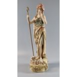 Royal Dux porcelain 352 figure of a shepherdess with lamb at her feet on a naturalistic base, 30cm