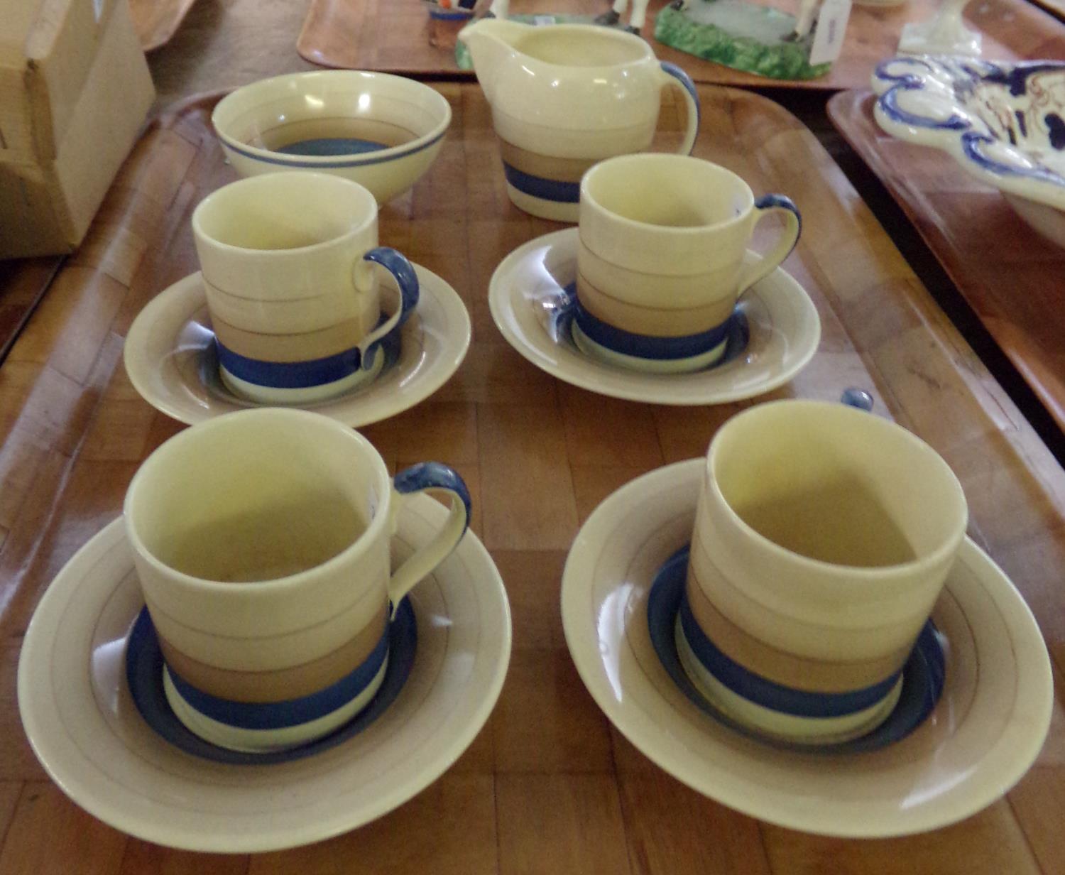 Tray of vintage Susie Cooper part coffee ware: four espresso cups and saucers, sugar bowl and milk
