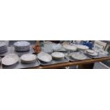 Four trays of china to include: two trays of Staffordshire floral blue and gilt edged dinnerware;