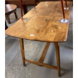 Ercol style elm kitchen table, having tapering legs and central stretcher. 137x67x73cm approx. (B.P.