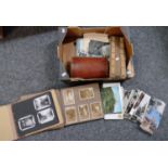 Box containing wooden cribbage board, two photograph albums with black and white photographs, one