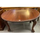 Late Victorian mahogany extending dining table of oval form with gadrooned edge, standing on