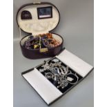 Jewellery box containing large collection of costume jewellery: beads and other items together