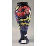 Modern Moorcroft art pottery tube lined Anemone vase. 28cm high approx. Impressed and painted