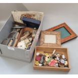 Tub of oddments, to include: picture frames, enamel and other badges, pin cushion in the form of a