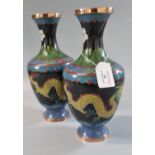 Pair of Chinese black ground cloisonne baluster shaped vases depicting dragons chasing flaming
