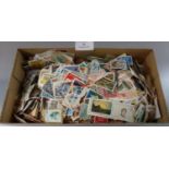 Shoe box of all world off paper stamps. 1000s. (B.P. 21% + VAT)