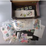 Shoe box of all world stamps on cards, in packets, covers etc. 100s, mint and used. (B.P. 21% + VAT)
