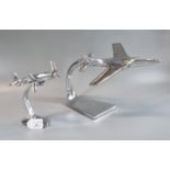 Two similar aluminium desk models of aircraft, to include: Two engined bomber and a jet fighter