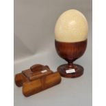 Large Ostrich egg with treen goblet together with a wooden lidded box in the form of a stylised