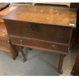 17th century oak bible box having pull-out drawer with drop handles standing on a removeable