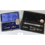 Two silver propelling pencils with stone set terminals, a stone set 9ct gold stick pin, a cased