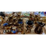 Two trays of copper lustre items to include : dresser jugs and urn, in various sizes, with