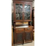Edwardian mahogany two stage two door astragal glazed bookcase above two drawers and two carved
