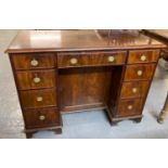 18th century style mahogany desk, the moulded top above a bank of four drawers to each pedestal with