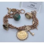 9ct gold charm bracelet with various gold and other metal charms, including; George V half sovereign