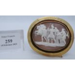 Classical large carved shell cameo brooch depicting scenes of Greek warriors and other figures in