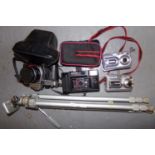 Aluminium camera tripod with box containing a Praktica Super TL 1000 SLR camera, two Fugi Film