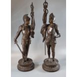 Pair of bronzed spelter figures of knights, each with drawn sword and standard. 41cm high approx. (