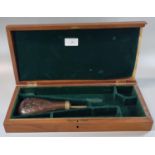 Modern hardwood fitted pistol box together with a repousse copper powder flask. (2) (B.P. 21% + VAT)