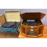 Vintage Crosley travelling record player with carrying handle together with a reproduction vintage