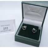 Pair of 9ct white gold heart shaped earrings set with black diamonds. 1g approx. Cased. (