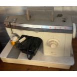 Vintage electrical Singer sewing machine in travel case. (B.P. 21% + VAT)